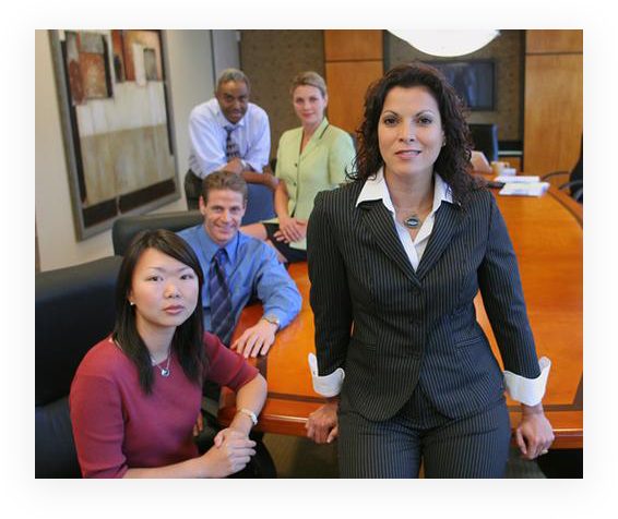 A group of people in an office setting.